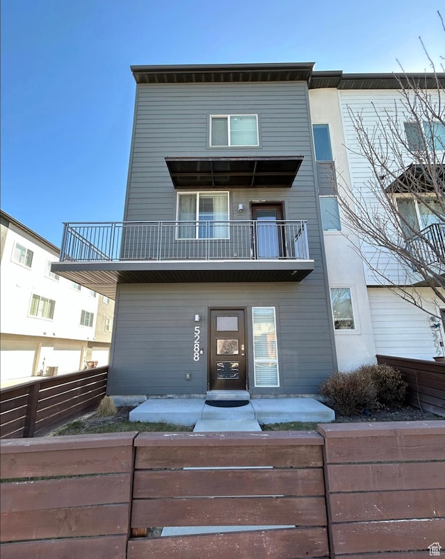 5288 W Solafax Ln Unit 34-1, Herriman, UT 84096 - rear view of house with a balcony