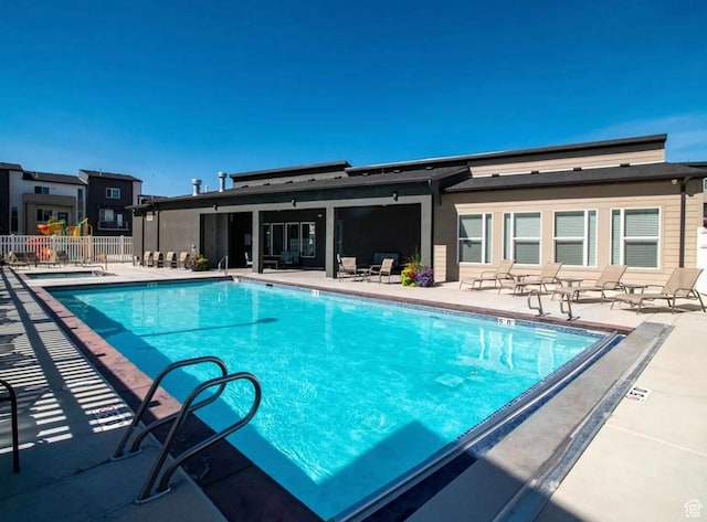 5288 W Solafax Ln Unit 34-1, Herriman, UT 84096 - community pool with a patio