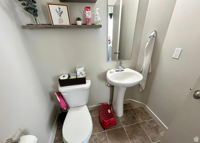 5288 W Solafax Ln Unit 34-1, Herriman, UT 84096 - half bathroom with toilet, baseboards, and tile patterned floors