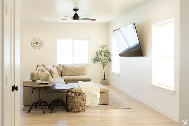 4745 E Silver Moon Dr, Eagle Mountain, UT 84005 - living area with healthy amount of natural light, light wood-style floors, and ceiling fan