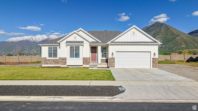 492 N 910 E, Salem, UT 84653 - view of front facade featuring board and batten siding, stone siding, driveway, and a mountain view