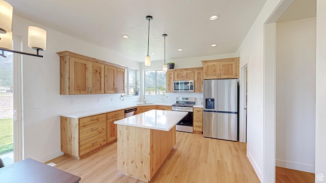 492 N 910 E, Salem, UT 84653 - kitchen with appliances with stainless steel finishes, light brown cabinets, light wood-style floors, light countertops, and recessed lighting