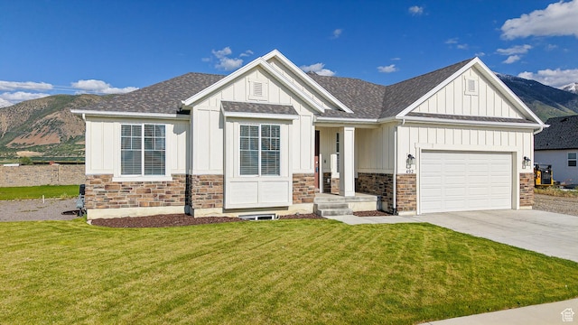 492 N 910 E, Salem, UT 84653 - view of front of house with board and batten siding, driveway, a front lawn, and an attached garage