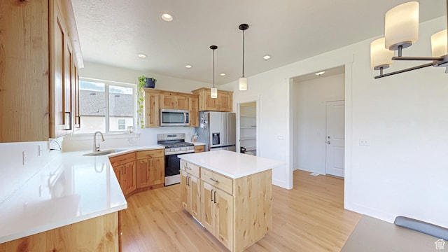492 N 910 E, Salem, UT 84653 - kitchen with stainless steel appliances, a sink, light wood-type flooring, light brown cabinetry, and recessed lighting