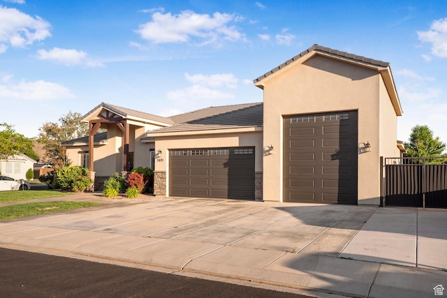 3691 W 2800 S, Hurricane, UT 84737 - view of front of property featuring stucco siding, a garage, driveway, and a tiled roof