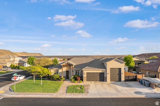 3691 W 2800 S, Hurricane, UT 84737 - ranch-style home featuring an attached garage, driveway, stucco siding, a residential view, and a tiled roof