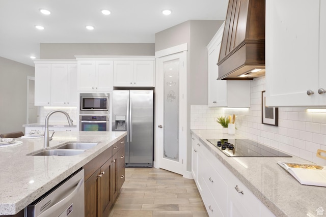 3691 W 2800 S, Hurricane, UT 84737 - kitchen with appliances with stainless steel finishes, a sink, premium range hood, white cabinetry, and recessed lighting