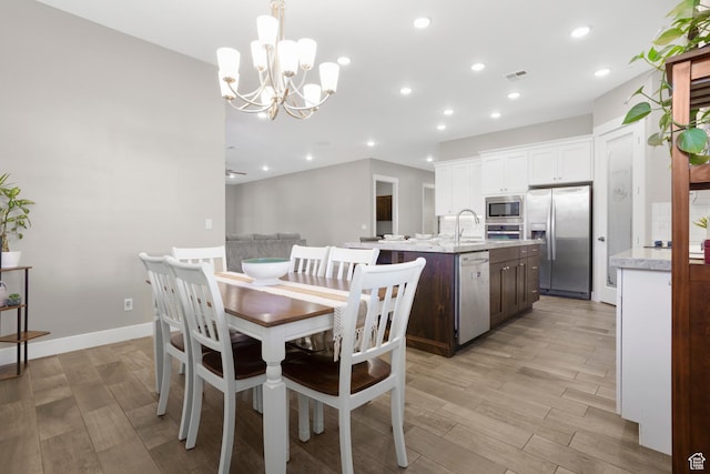 3691 W 2800 S, Hurricane, UT 84737 - dining room with light wood-type flooring, a chandelier, recessed lighting, and baseboards
