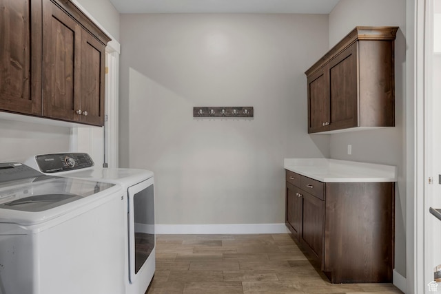 3691 W 2800 S, Hurricane, UT 84737 - washroom featuring washing machine and dryer, cabinet space, light wood finished floors, and baseboards