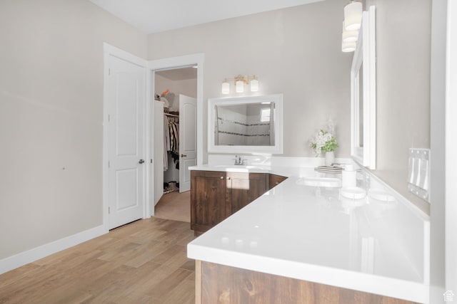 3691 W 2800 S, Hurricane, UT 84737 - bathroom featuring double vanity, wood finished floors, and a walk in closet