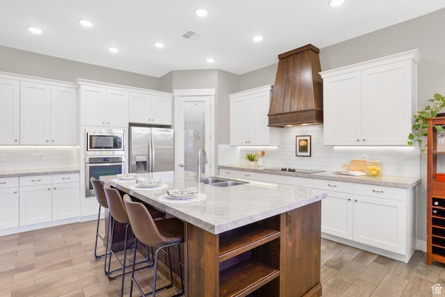 3691 W 2800 S, Hurricane, UT 84737 - kitchen featuring appliances with stainless steel finishes, premium range hood, a sink, open shelves, and tasteful backsplash