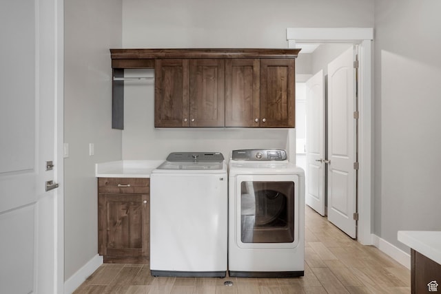 3691 W 2800 S, Hurricane, UT 84737 - laundry area featuring cabinet space, washer and clothes dryer, baseboards, and light wood finished floors