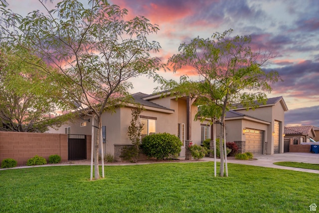 3691 W 2800 S, Hurricane, UT 84737 - view of front facade with concrete driveway, stucco siding, an attached garage, and a gate