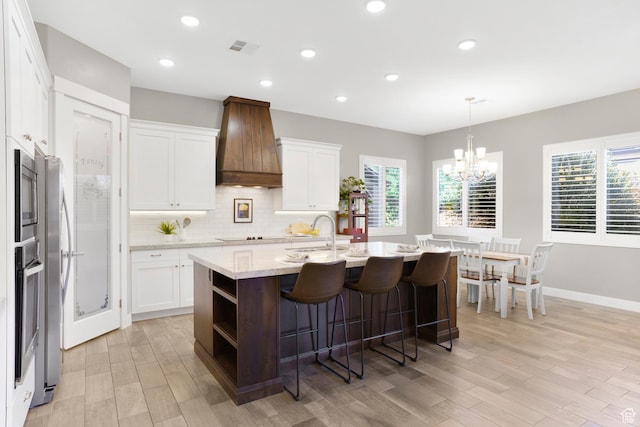 3691 W 2800 S, Hurricane, UT 84737 - kitchen with premium range hood, a sink, white cabinetry, a chandelier, and recessed lighting