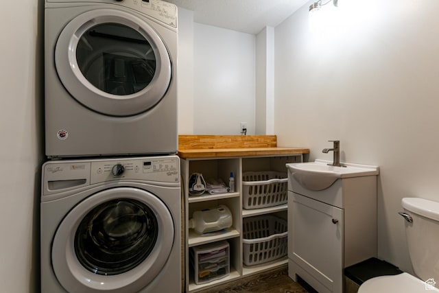 545 W Applewood Dr S # 10, Bountiful, UT 84010 - washroom featuring stacked washer / drying machine and dark wood finished floors