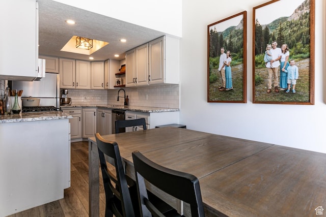 545 W Applewood Dr S # 10, Bountiful, UT 84010 - kitchen featuring open shelves, dark wood finished floors, backsplash, dishwashing machine, and light stone counters