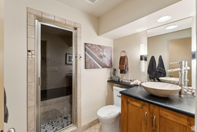 4517 S Abinadi Rd, Millcreek, UT 84124 - full bathroom with vanity, a shower stall, toilet, and tile patterned flooring