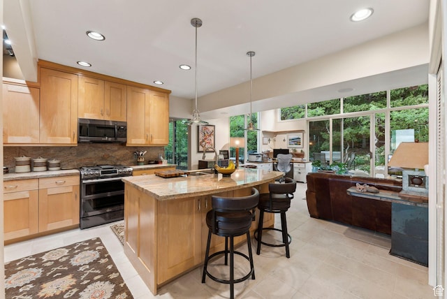 4517 S Abinadi Rd, Millcreek, UT 84124 - kitchen featuring double oven range, open floor plan, backsplash, plenty of natural light, and recessed lighting