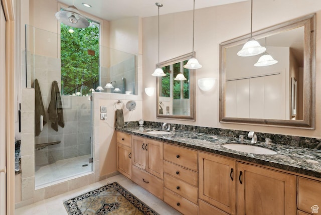 4517 S Abinadi Rd, Millcreek, UT 84124 - full bathroom with double vanity, a shower stall, and tile patterned flooring
