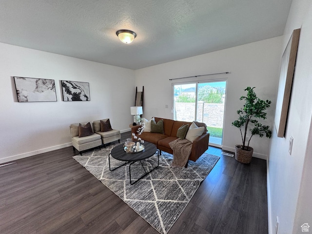 12754 S Quail Lake Dr Unit 126, Riverton, UT 84096 - living area featuring dark wood finished floors, baseboards, and a textured ceiling