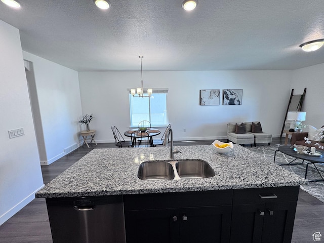 12754 S Quail Lake Dr Unit 126, Riverton, UT 84096 - kitchen featuring a sink, dishwasher, dark cabinets, a center island with sink, and open floor plan