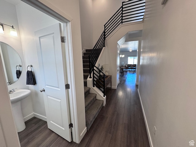 12754 S Quail Lake Dr Unit 126, Riverton, UT 84096 - hall featuring dark wood-style flooring, stairway, and baseboards