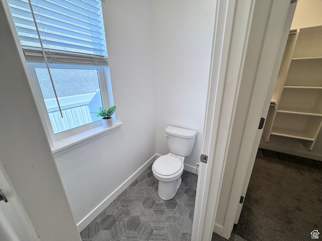 12754 S Quail Lake Dr Unit 126, Riverton, UT 84096 - bathroom featuring toilet and baseboards
