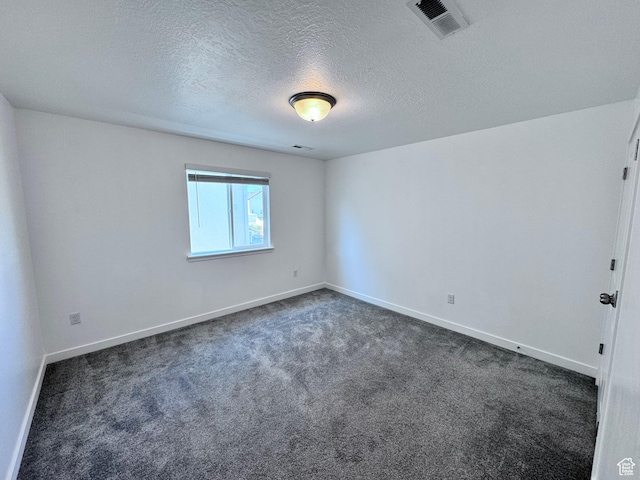 12754 S Quail Lake Dr Unit 126, Riverton, UT 84096 - spare room with dark colored carpet, baseboards, and a textured ceiling