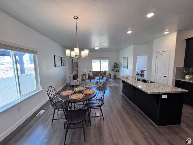 12754 S Quail Lake Dr Unit 126, Riverton, UT 84096 - dining area with dark wood-style floors, baseboards, a chandelier, a textured ceiling, and recessed lighting