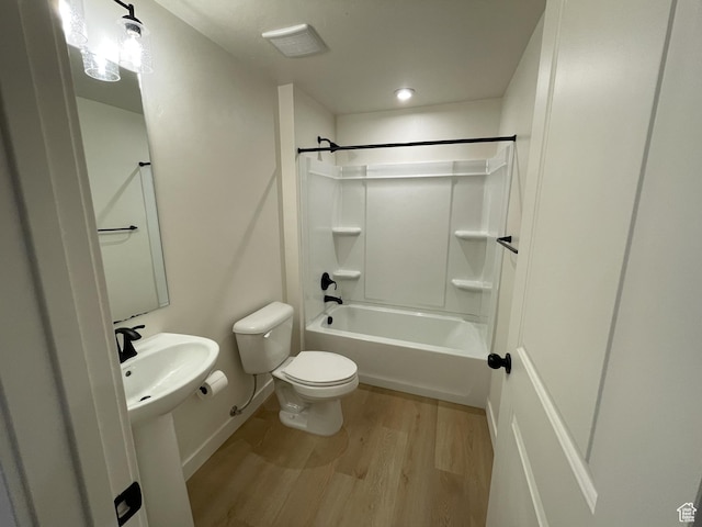 4357 E Longleaf Ln, Eagle Mountain, UT 84005 - bathroom with wood finished floors, toilet, shower / tub combination, and baseboards