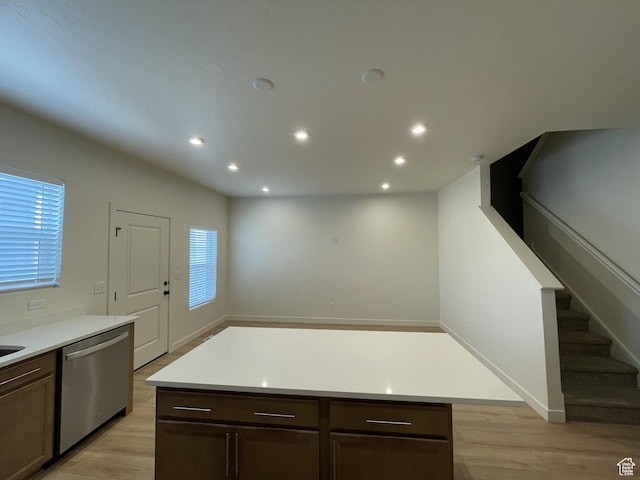 4357 E Longleaf Ln, Eagle Mountain, UT 84005 - kitchen with stainless steel dishwasher, light wood-style floors, light countertops, recessed lighting, and dark brown cabinets