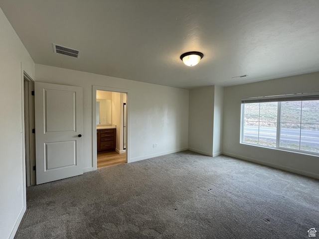 4357 E Longleaf Ln, Eagle Mountain, UT 84005 - unfurnished bedroom featuring carpet, baseboards, and ensuite bath