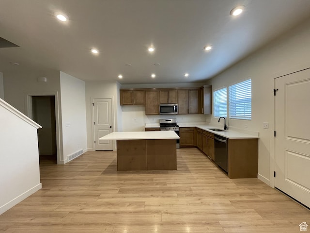 4357 E Longleaf Ln, Eagle Mountain, UT 84005 - kitchen with appliances with stainless steel finishes, a sink, a center island, light countertops, and recessed lighting
