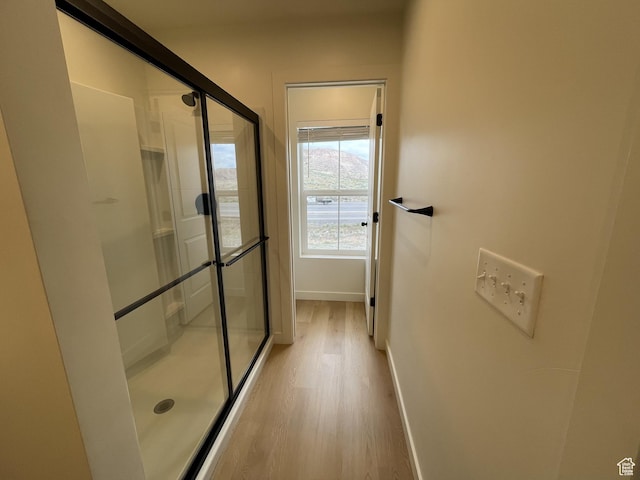 4357 E Longleaf Ln, Eagle Mountain, UT 84005 - full bath featuring a shower stall, wood finished floors, and baseboards