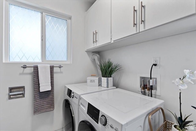 902 E 500 S Unit E, Salt Lake City, UT 84102 - laundry area featuring washing machine and dryer, plenty of natural light, and cabinet space
