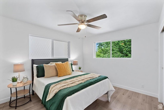 902 E 500 S Unit E, Salt Lake City, UT 84102 - bedroom with light wood-style floors, baseboards, and ceiling fan