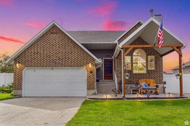 6864 S 3370 W, West Jordan, UT 84084 - view of front of home with driveway, brick siding, an attached garage, and roof with shingles