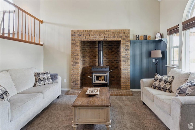 6864 S 3370 W, West Jordan, UT 84084 - living area featuring carpet, a wood stove, and a towering ceiling