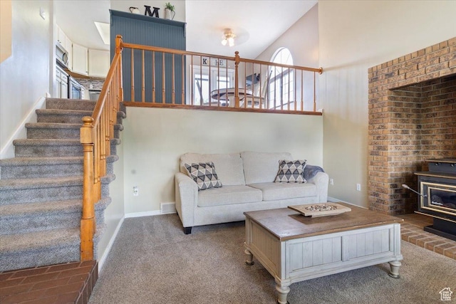 6864 S 3370 W, West Jordan, UT 84084 - living area with a wood stove, stairs, carpet floors, and a towering ceiling