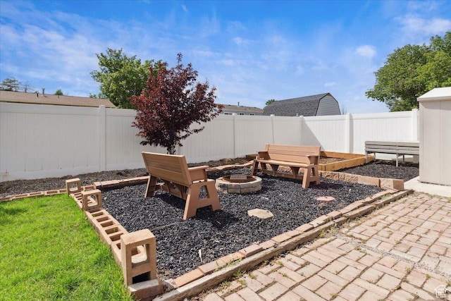 6864 S 3370 W, West Jordan, UT 84084 - fenced backyard with a fire pit and a patio area