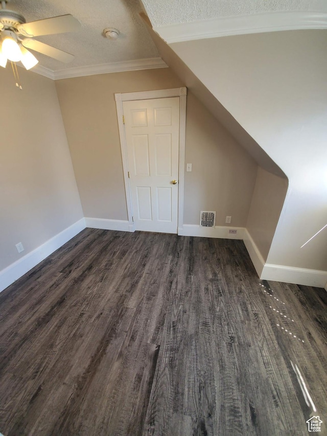 827 E Third Ave N, Salt Lake City, UT 84103 - additional living space with dark wood-style flooring, ceiling fan, baseboards, and a textured ceiling