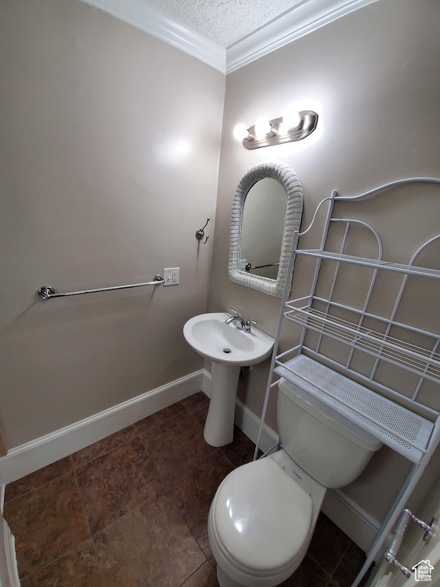 827 E Third Ave N, Salt Lake City, UT 84103 - half bathroom with baseboards, toilet, ornamental molding, and a textured ceiling
