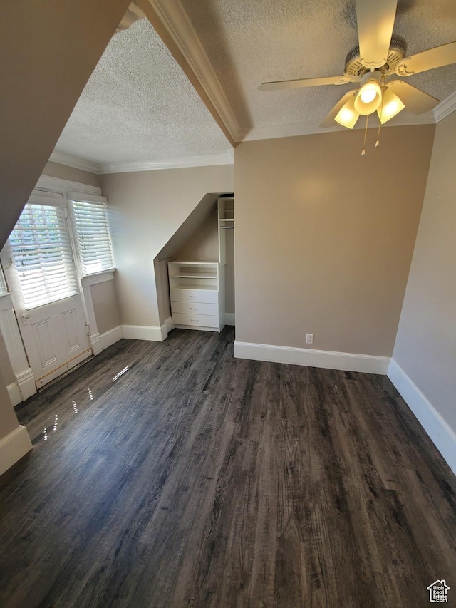 827 E Third Ave N, Salt Lake City, UT 84103 - additional living space featuring a textured ceiling, ceiling fan, dark wood finished floors, and baseboards