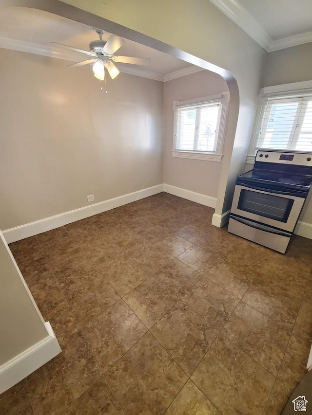 827 E Third Ave N, Salt Lake City, UT 84103 - unfurnished living room with crown molding, arched walkways, a ceiling fan, baseboards, and dark tile patterned flooring
