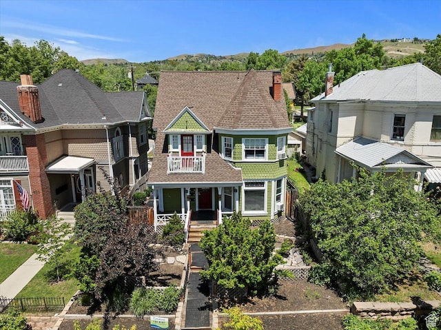 827 E Third Ave N, Salt Lake City, UT 84103 - view of front facade featuring a balcony, a porch, and a mountain view