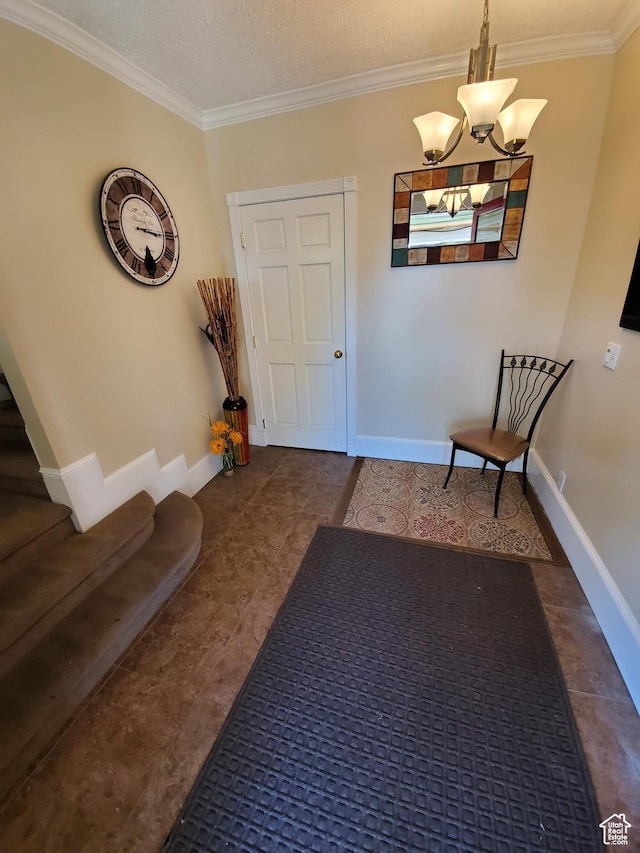 827 E Third Ave N, Salt Lake City, UT 84103 - entrance foyer with ornamental molding, a chandelier, baseboards, and tile patterned flooring