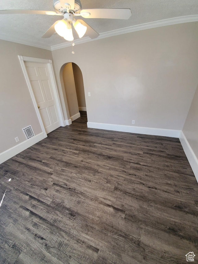 827 E Third Ave N, Salt Lake City, UT 84103 - spare room with dark wood-style flooring, a ceiling fan, arched walkways, baseboards, and ornamental molding