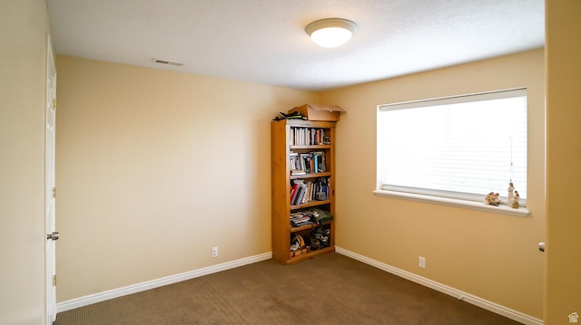 146 S 1125 W, Layton, UT 84041 - empty room featuring dark colored carpet and baseboards