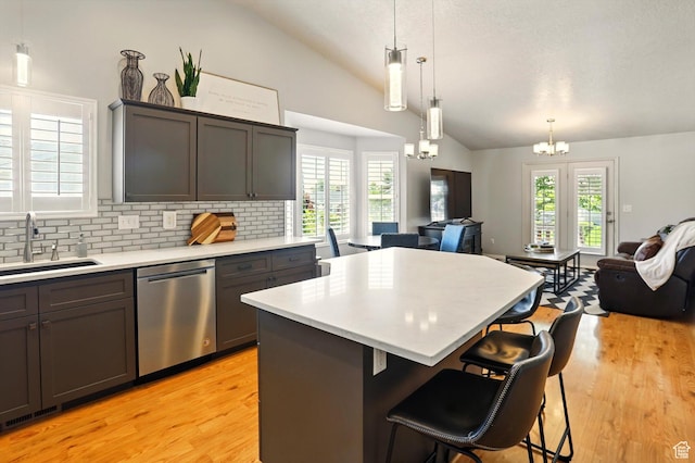 146 S 1125 W, Layton, UT 84041 - kitchen with lofted ceiling, stainless steel dishwasher, open floor plan, a chandelier, and a sink