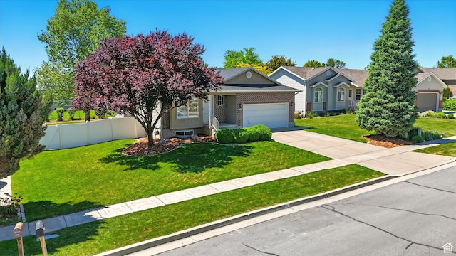 146 S 1125 W, Layton, UT 84041 - obstructed view of property with an attached garage, concrete driveway, and brick siding